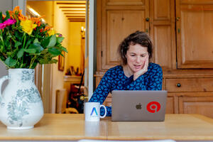 The Freelance Bible's author Alison Grade working from home with her laptop computer.