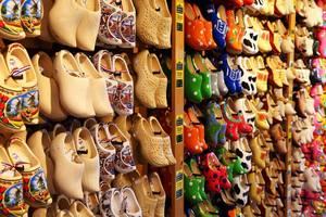 Lots of Dutch clogs hanging on a wall
